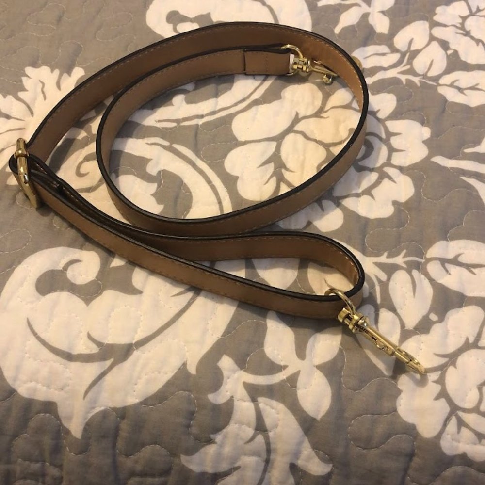 Beige crossbody strap for purse.